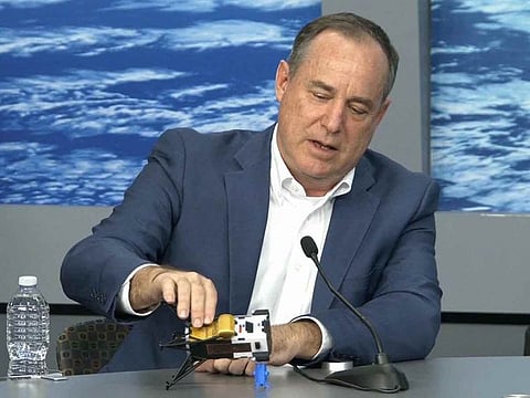 This frame grab from Nasa, shows Intuitive Machines CEO Steve Altemus holding a model of Odysseus to show its position on the side during a press conference at Johnson Space Center in Houstom, Texas on February 23, 2024.