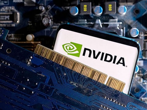 A smartphone with a displayed NVIDIA logo is placed on a computer motherboard in this illustration.