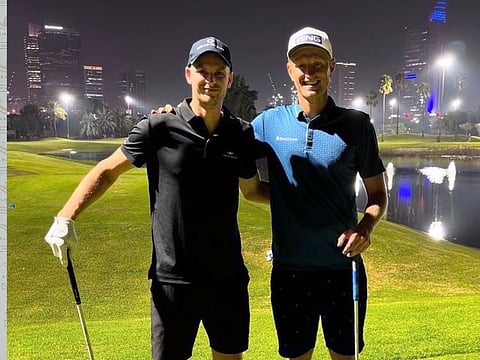 Hubert Hurkacz and Adrian Meronk enjoy a round of golf at Emirates Golf Club