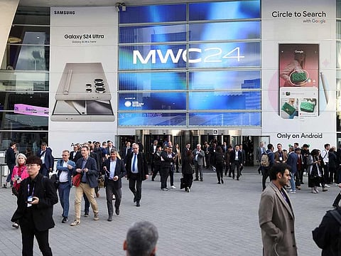 People exit the Mobile World Congress (MWC) in Barcelona, on February 27, 2024.