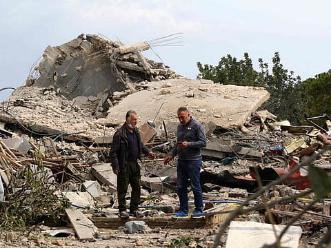 Men check the site of an Israeli air strike that targeted a house in the southern Lebanese village of Jibshit on February 27, 2024. Since October 8, following the Hamas attack on southern Israel and the start of Israel's relentles bombardment of the Gaza Strip, Hezbollah and its arch-foe neighbour have exchanged near-daily fire, but strikes have been largely contained to the border between the two countries -- although Israel has on occasion launched strikes elsewhere in Lebanon, including in Beirut.