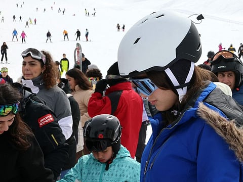 Skiers queue to enter the Lebanese ski resort of Faraya, in Mount Lebanon north of Beirut.