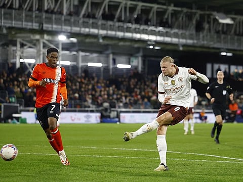 Manchester City's Erling Braut Haaland scores their fifth goal during the FA Cup fifth round against Luton Town at Kenilworth Road, Luton, Britain on Tuesday.