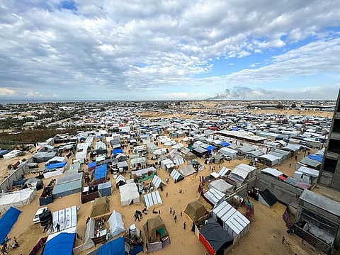 Displaced Palestinians, who fled their houses due to Israeli strikes, take shelter in a tent camp, amid the ongoing conflict between Israel and the Palestinian Islamist group Hamas, in Rafah.