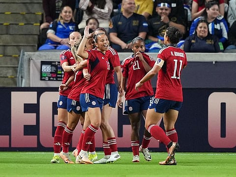 Costa Rica players celebrate a goal during a Group C match of the Concacaf Women's Gold Cup.