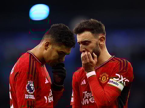 Manchester United's Casemiro and Bruno Fernandes look dejected after the Premier League match against Manchester City.