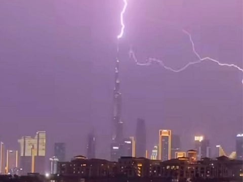 Lightning over Burj Khalifa. The Met Office has warned that there is a chance of more rainfall and even hail, in some parts of the country, tonight.