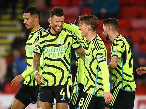 Arsenal's Ben White celebrates scoring their sixth goal with Martin Odegaard during a Premier League match against Sheffield United at Bramall Lane, Sheffield on Monday.