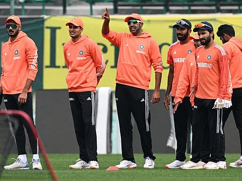India's Ravichandran Ashwin (3rd from left) gestures next to teammates during a practice session at the Himachal Pradesh Cricket Association Stadium in Dharamsala on Tuesday.