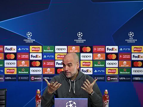 Manchester City's Spanish manager Pep Guardiola attends a press conference at Manchester City's training ground in north-west England on Tuesday.
