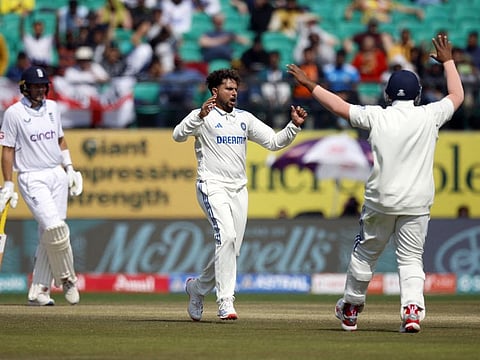 India's Kuldeep Yadav celebrates after taking the wicket of England's Jonny Bairstow, caught out by Dhruv Jurel during the fifth Test at Himachal Pradesh Cricket Association Stadium, Dharamshala, India, on Thursday.