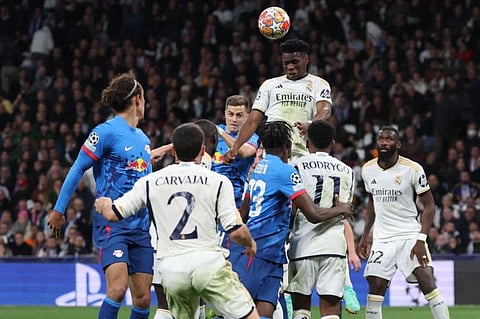 Real Madrid's French defender Aurelien Tchouameni wins a header during the Uefa Champions League last 16 second leg match against RB Leipzig at the Santiago Bernabeu stadium in Madrid on Wednesday.