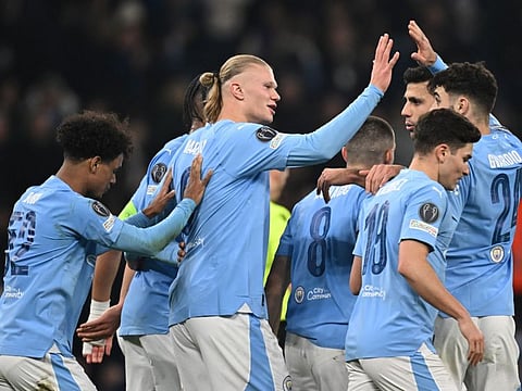 Manchester City's striker Erling Haaland (centre) celebrates with teammates after scoring their third goal during the Uefa Champions League round of 16, second-leg, match against FC Copenhagen at the Etihad Stadium, in Manchester, north west England, on March 6, 2024. (Photo by Paul ELLIS / AFP)