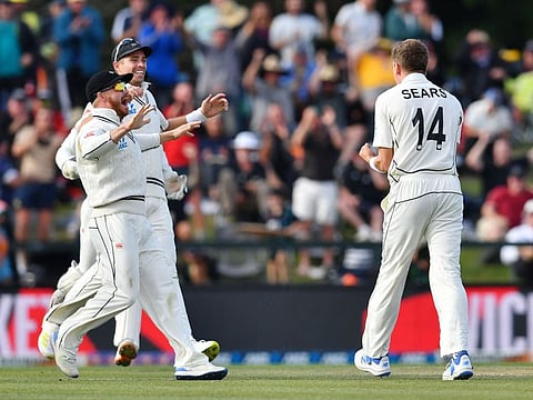 New Zealand's Ben Sears (right) and his teammates celebrate the wicket of Australia's Cameron Green on day three of the second Test cricket matchat Hagley Oval in Christchurch on Sunday.