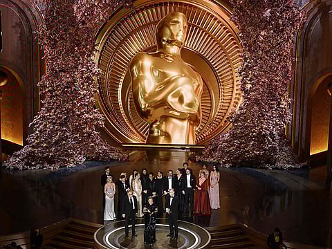 Producers of "Oppenheimer" British film producer Emma Thomas (C), US film producer Charles Roven (L) and British filmmaker Christopher Nolan accept the award for Best Picture onstage during the 96th Annual Academy Awards at the Dolby Theatre in Hollywood, California on March 10, 2024.