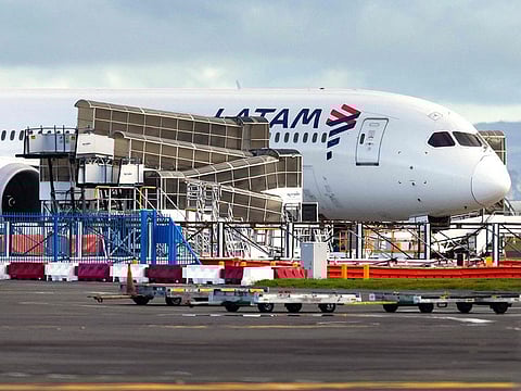 The LATAM Airlines Boeing 787 Dreamliner plane that suddenly lost altitude mid-flight a day earlier, dropping violently and injuring dozens of terrified travellers, is seen on the tarmac of the Auckland International Airport in Auckland.