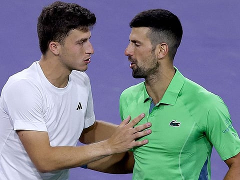 Luca Nardi is congratulated by Novak Djokovic after their third round match at Indian Wells Tennis Garden on Monday.