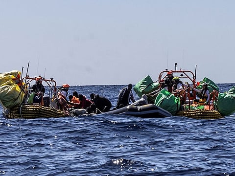 Migrants are rescued by crew members of the rescue ship Ocean Viking run by NGO SOS Mediterranee during a search and rescue operation in the central Mediterranean Sea, March 13, 2024.