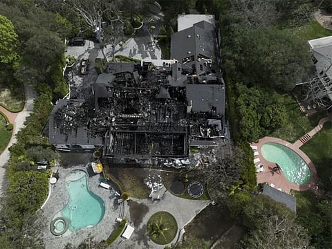 An aerial view shows a fire-damaged property, which appears to belong to Cara Delevingne, Friday, March 15, 2024, in the Studio City section of Los Angeles.