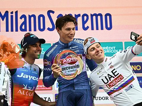 From left: Second placed Team Jayco Alula's Australian rider Michael Matthews, first placed Alpecin-Deceuninck's Belgian rider Jasper Philipsen and third placed UAE Team Emirates' Slovenian rider Tadej Pogacar celebrate on the podium on Sunday.