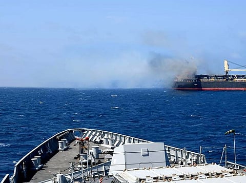 This handout photograph taken on March 6, 2024 and released by the Indian Navy shows the Barbados-flagged bulk carrier following a attack by Yemen's Houthi militants, in Gulf of Aden.