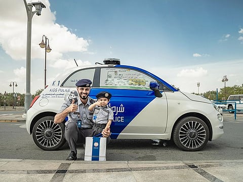 The boy was gifted a uniform as he patrolled the streets in a special 'Kids Police' vehicle alongside the official