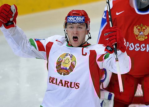 Belarus Konstantin Koltsov celebrates his team's first goal in front of Russian goalkeeper Ilya Bryzgalov during their quarter-final game in 2009.