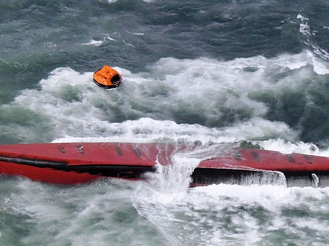 A South Korean tanker is seen capsized off Mutsure Island, Yamaguchi prefecture, southwestern Japan