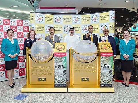 DDF representatives with the two tickets that won $1 million each on Wednesday