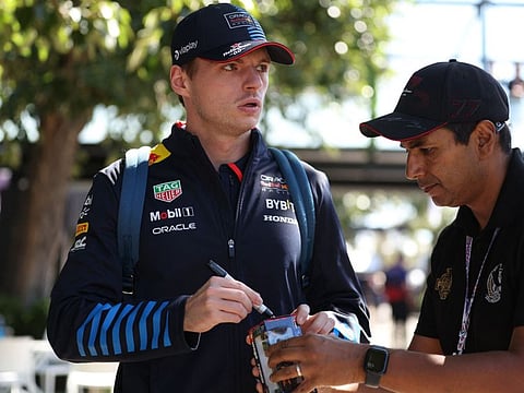 Red Bull Racing's Dutch driver Max Verstappen gives an autograph ahead of the Formula One Australian Grand Prix in Melbourne on Thursday.
