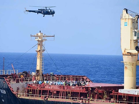 Pirates detained by the Indian navy during a rescue operation for the hijacked ship MV Ruen sit on the deck in this handout image released on March 16, 2024.