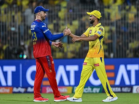 Chennai Super Kings' captain Ruturaj Gaikwad shakes hands with his Royal Challengers Bangalore's counterpart and his former opening partner Faf du Plessis (left) at the end of the opener on Friday.