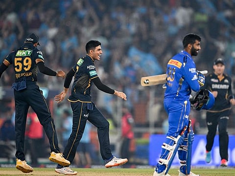 Gujarat Titans' captain Shubman Gill celebrates with his teammate after winning the Indian Premier League Twenty20 cricket match against Mumbai Indians at the Narendra Modi Stadium in Ahmedabad on Sunday.