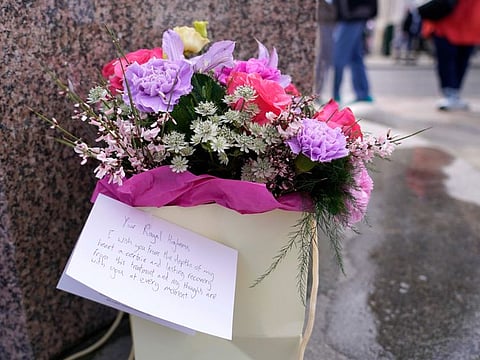 Flowers and a letter to the Princess of Wales were left outside Windsor Castle in Windsor, England, Saturday, March 23, 2024.