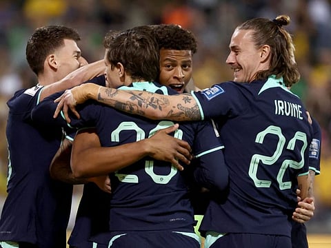 Australias Kusini Yengi (centre) celebrates with teammates after scoring a goal during the Fifa World Cup 2026 qualifier football match against Lebanon at Bruce Stadium in Canberra on Tuesday.