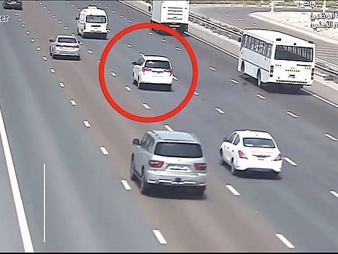 Still from police video showing stopped vehicle about to be hit by traffic in Abu Dhabi