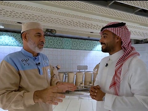 Hussain talks to Al Ekhbariya reporter at the Grand Mosque in Mecca.