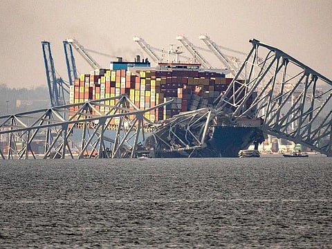 Part of the steel frame of the Francis Scott Key Bridge sits on top of the container ship Dali after the bridge collapsed in Baltimore, Maryland, on March 26, 2024.