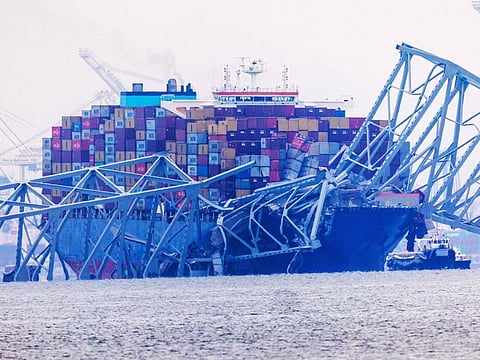 Cargo ship Dali sits in the water after running into and collapsing Baltimore's Francis Scott Key Bridge on March 27, 2024.