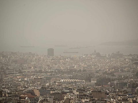 The city of Athens shrouded in haze as persistent southerly winds have carried waves of dust from the African continent across the eastern Mediterranean.