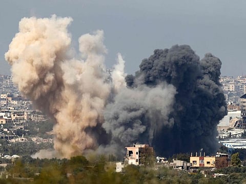 This picture taken from Israel's southern border with the Gaza Strip shows smoke billowing following an Israeli strike in the besieged Palestinian territory on March 27, 2024