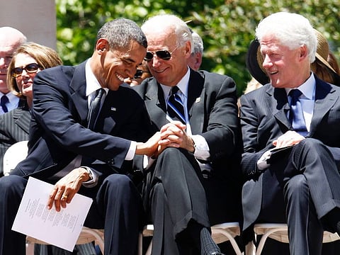 Obama, Biden, and Bill Clinton in a July 2, 2010, file photo at the Capitol in Charleston. Obama and Clinton are helping Biden expand his already significant cash advantage over Trump. Biden had $155 million in cash on hand through the end of February, compared with $37 million for Trump and his Save America political action committee.