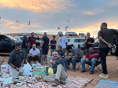 As the sun dips below the horizon, marking the Maghrib prayer time (sunset), the diverse off-roading groups gather for a collective Iftar.