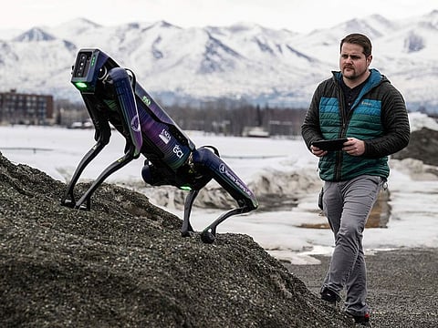 Alaska Department of Transportation program manager Ryan Marlow demonstrates the agency's robotic dog in Anchorage, Alaska.