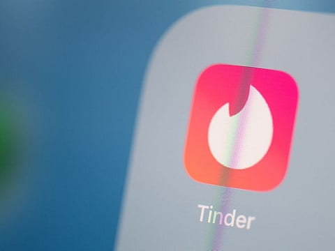 This picture taken on July 24, 2019 in Paris shows the logo of the US social networking application Tinder on the screen of a tablet. (For illustrative purposes only)