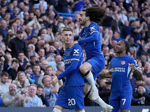 Chelsea's Cole Palmer (left) celebrates with teammates after scoring his sides second goal during the English Premier League match against Burnley at Stamford Bridge in London.