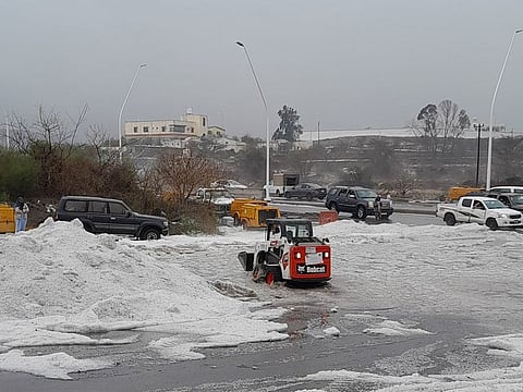 Municipal workers and field teams clearing the hail from major roads and streets to facilitate the resumption of normal traffic flow.