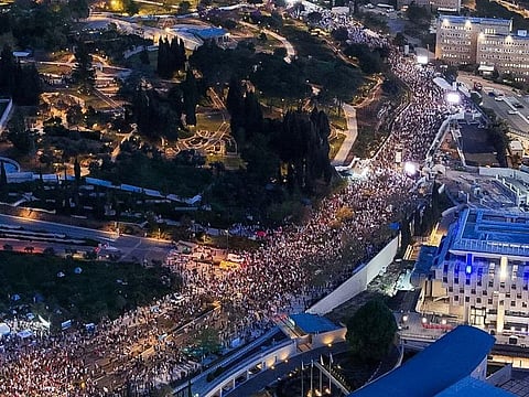 People protest against Israeli Prime Minister Netanyahu's government and call for the release of hostages, in Tel Aviv.