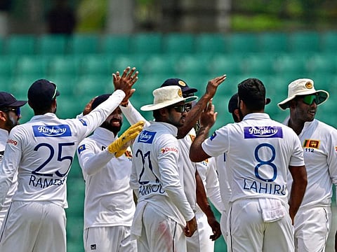 Sri Lankas players celebrate the dismissal of Bangladeshs Hasan Mahmud during the final day of the second Test.