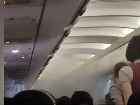 A screengrab from the video taken by a passenger shows smoke in the cabin of a Royal Air Philippines flight RW602 following a fire triggered by a powerbank explosion on February 19, 2024.